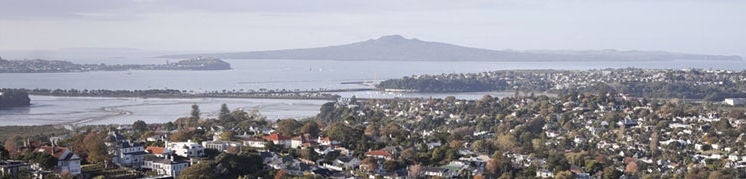 Arial photograph showing Waitemata harbour with Rangitoto in the background.