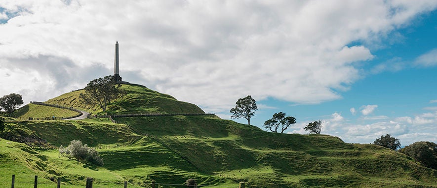 Photograph of the One Tree Hill summit and obelisk from inside Cornwall park