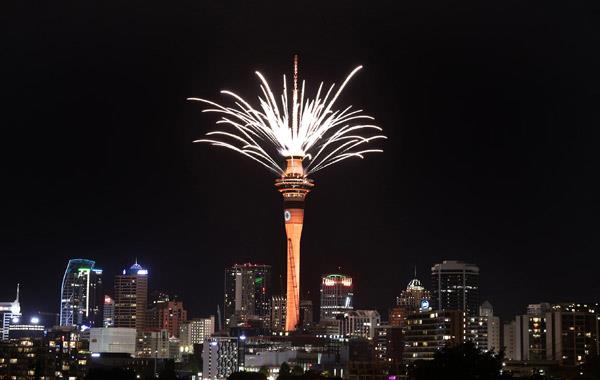 The Sky Tower at night time with fireworks.