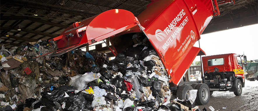 Rubbish truck dumping rubbish at a station.