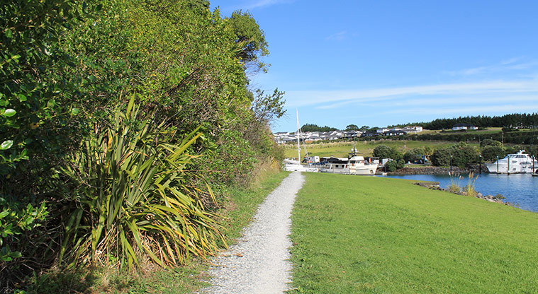 98 Pinecrest Drive - Section of path with bush on the left and the marina on the right. . Photo credit: M Loubser.