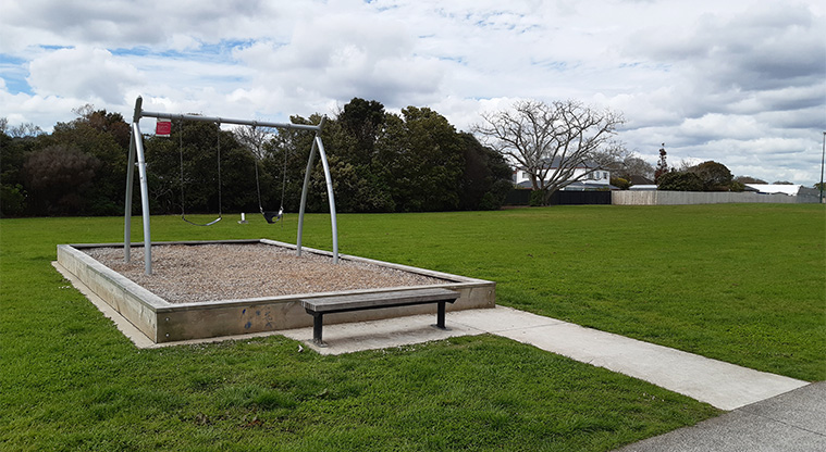Alan Wood Reserve - Set of two swings with nearby seating.