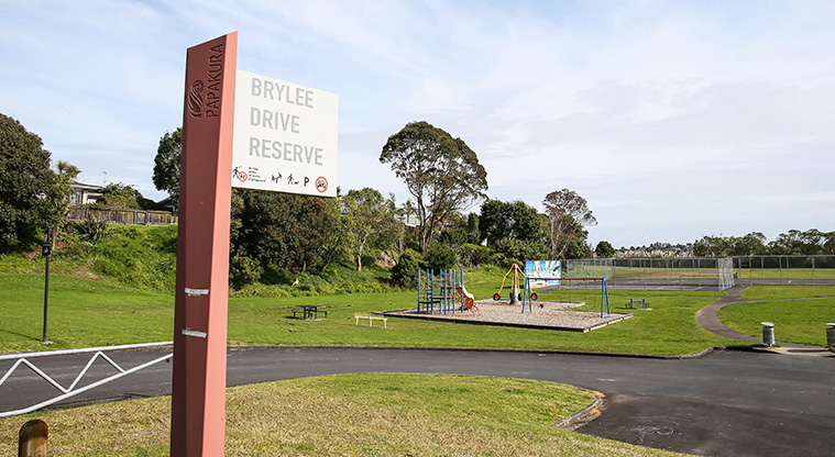 O-tua-uru / Brylee Drive Reserve - Reserve sign with the playground in the background.