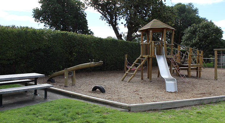 Centennial Park - Children's playground, seesaw and picnic table.
