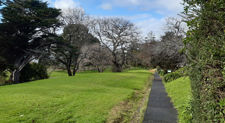 Chelsea Estate Heritage Park - Path running alongside open grassed space and established trees.