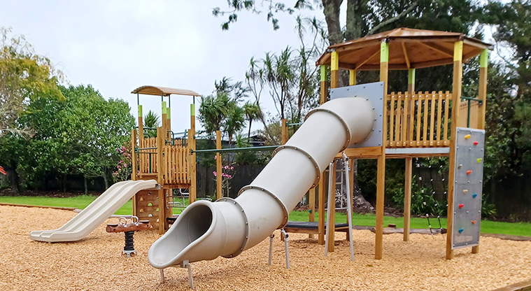 Collins Park - High play module with a climbing wall, rope ladder, tube slide and more.