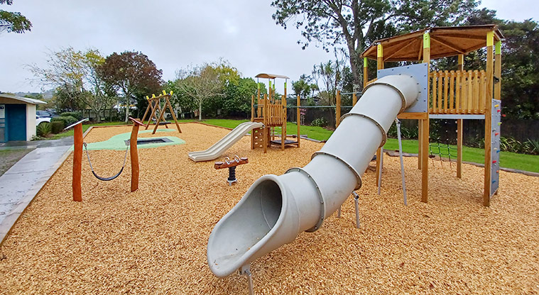 Collins Park - Playground on a bark surface with swings, climbing towers, in-ground trampoline, slides and more.