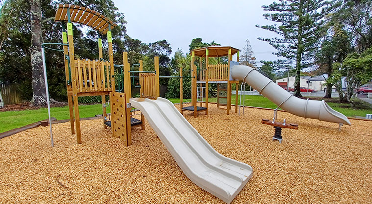 Collins Park - Two play modules - one with a low double slide and the other with a high tube slide.