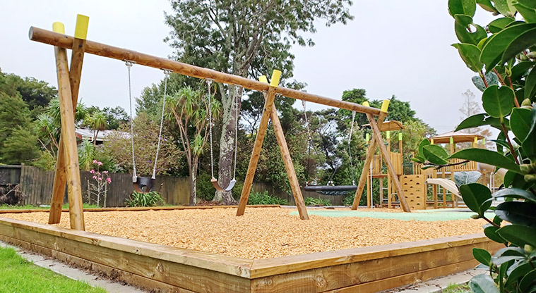 Collins Park - Swing set with the climbing towers in the background.
