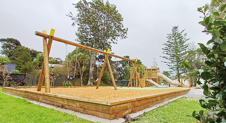 Collins Park - Playground on a raised bark base with swings, climbing towers, slides and more.