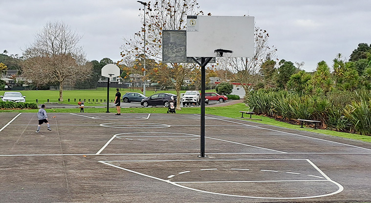 Crossfield Reserve - Basketball court with the car park and sports fields in the background.