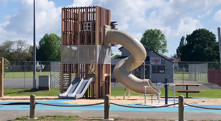 Edith Hopper Park - Tall tower with multiple levels, two low slides and a high tube slide.