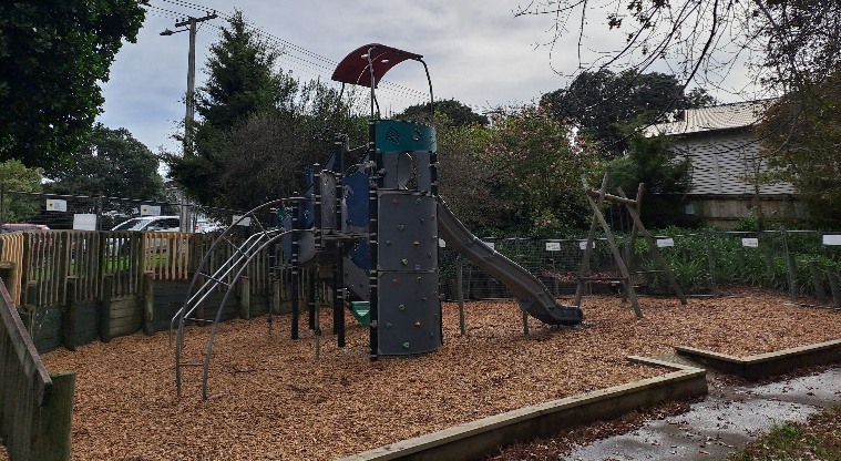 Ellerslie Domain - Whole playground with a slide, swings and climbing equipment.