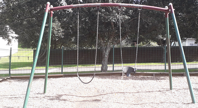 Kohuora Park - Swings in the playground.