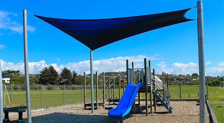 Gulf Harbour Recreation Reserve - Children's playground with slide, climbing equipment and a shade sail. Photo credit: M Loubser