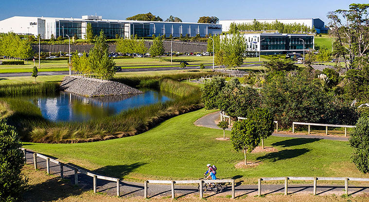 Highbrook Park – Section of the park showing the pond, and cyclists on one of the paths.