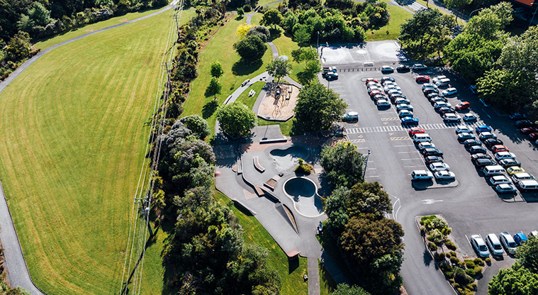 Hooton Reserve - Drone shot of a large section of the reserve with open grassed space, the playground and skate park, and part of the car park. Photo credit: Jay Farnworth.