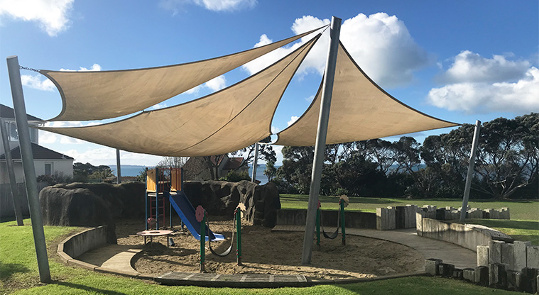 Kennedy Park - Junior slide, swings and sand under shade sails.
