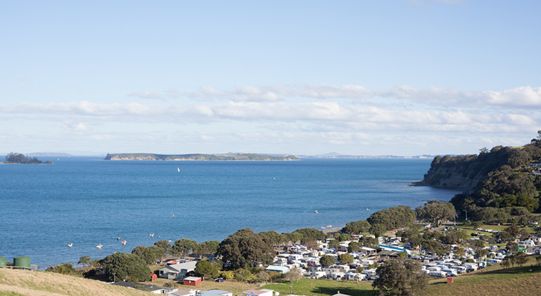 Martins Bay Holiday Park - View of the holiday park with the bay in the background.