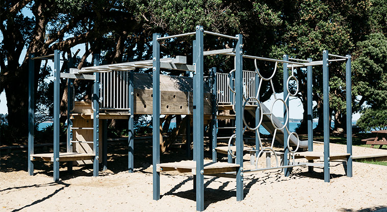Martins Bay Holiday Park - Playground with climbing equipment, tunnel and slide.
