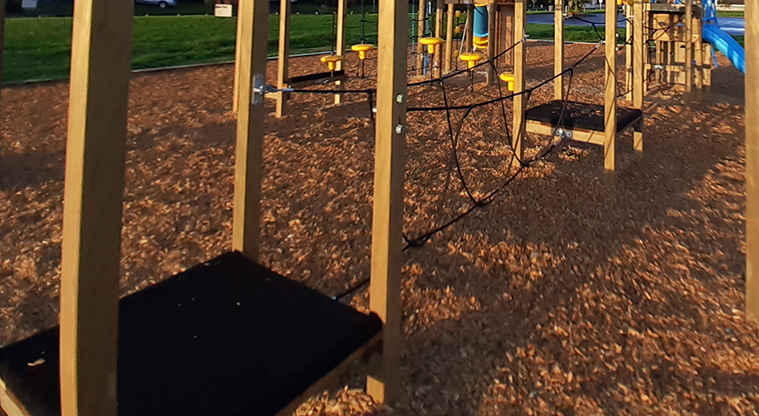 Meadowland Park - Two black platforms with balancing ropes stretched between them.
