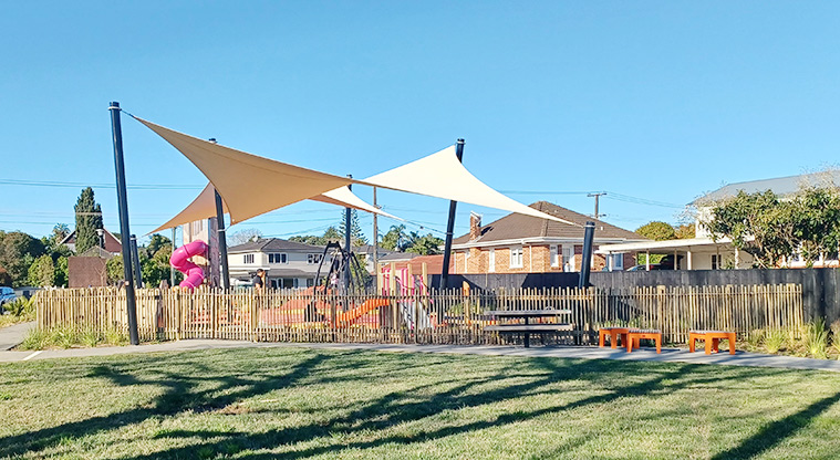 Michaels Avenue Reserve - View of the fenced playground from within the reserve.