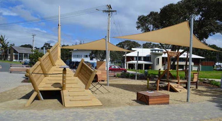 Milford Reserve - Natural wood ramps and platforms, with shade sails covering one section.