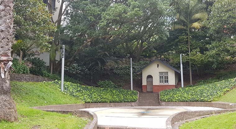 Myers Park - Heritage building and courtyard with a splash pad that is turned on in summer.