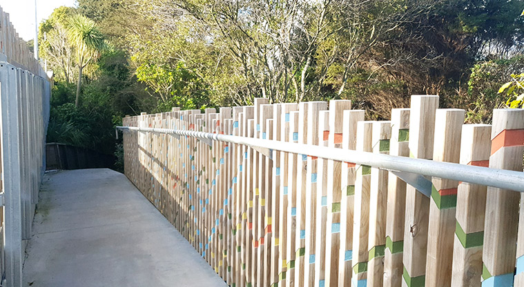 Newmarket Park - Coloured railings along the path at the entrance to the park.