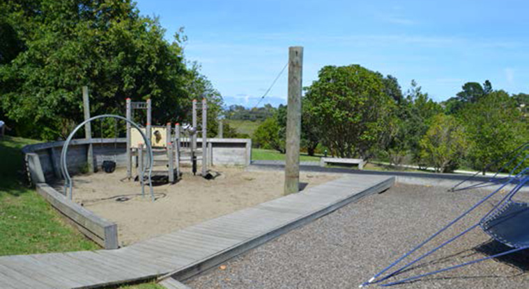 Northboro Reserve - Boat shaped playground with a boardwalk across the middle, small climbing frame and baby swing.