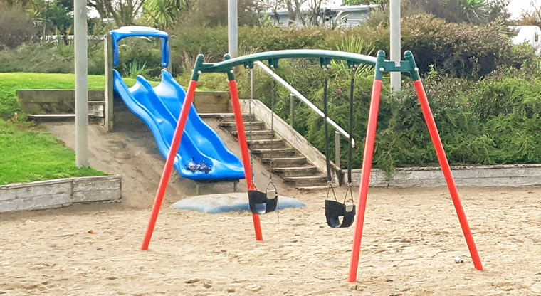 Olympic Park - Toddler slide and swings at the playground on the Wolverton Street side of the park.