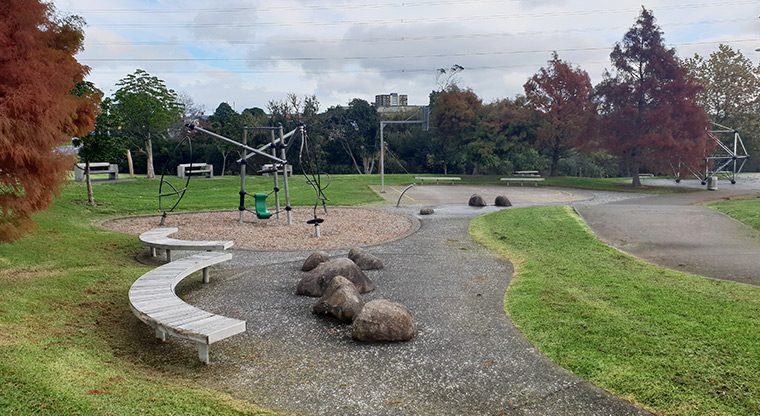 Olympic Park - Seating, playground and basketball half-court on the Wolverton Street side of the park.
