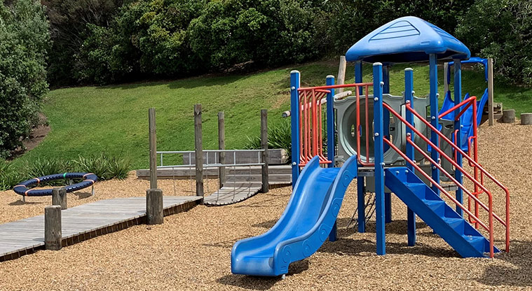 Omana Esplanade - Play module for younger children with the boardwalk and balance ring in the background.