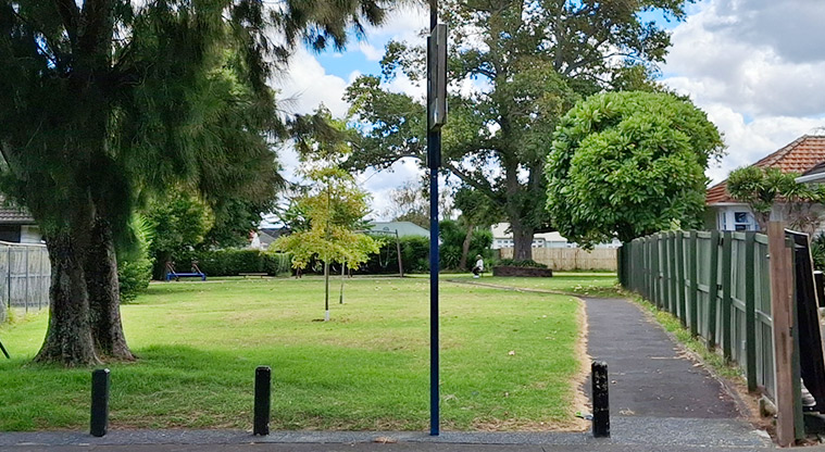 Orchard Reserve - Looking into the reserve from the Orchard Street entrance with a path, open grassed space and trees. Photo credit: T Hodder.