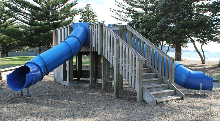 Ōrewa Domain - Northern playground has a wooden structure with two blue covered slides. Photo credit: M Loubser.