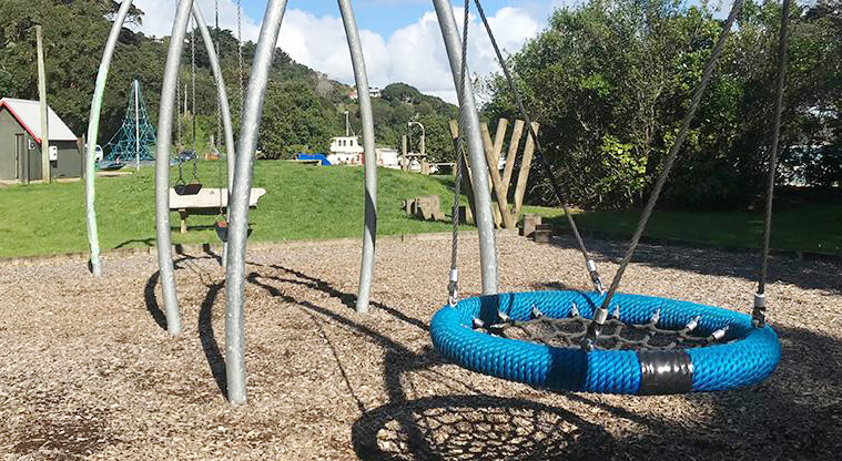 Ostend Domain - Section of the playground with a basket swing in the foreground.
