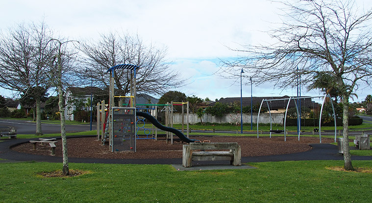 Paremuka Lakeside - Playground with swings, paths, seating and a rubbish bin. Photo credit: Tracey Hodder.