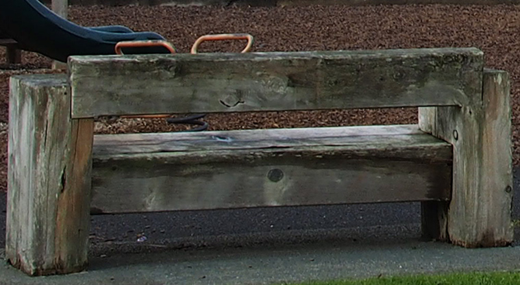Paremuka Lakeside - Large wooden seat next to the playground. Photo credit: Tracey Hodder.