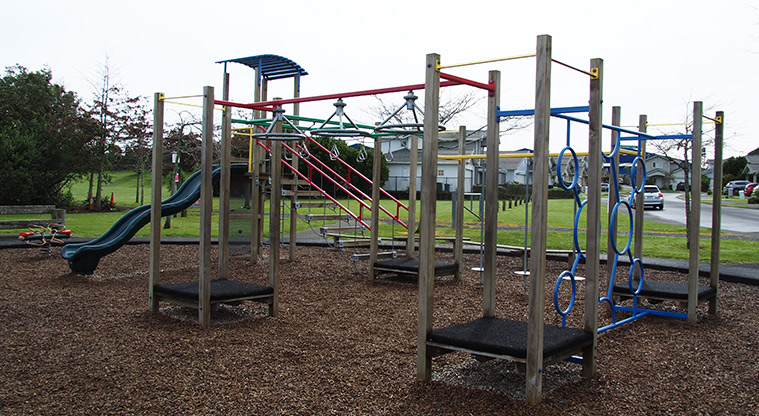 Paremuka Lakeside - Playground with climbing equipment, wobbly bridge, slide and rocker toy. Photo credit: Tracey Hodder.