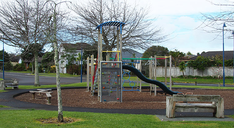 Paremuka Lakeside - Playground with climbing equipment, wobbly bridge, slide, balance beams and a seat in the foreground. Photo credit: Tracey Hodder.