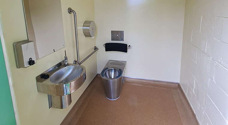 Rānui Domain - Inside one of the accessible toilets with lots of space for wheelchairs, prams and other mobility aids.