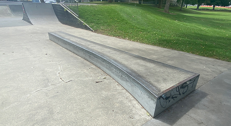 Otaawhati / Ray Small Park -&nbsp; Section of the skate park with a bench and open grassed space in the background. Photo credit: J Farnworth.