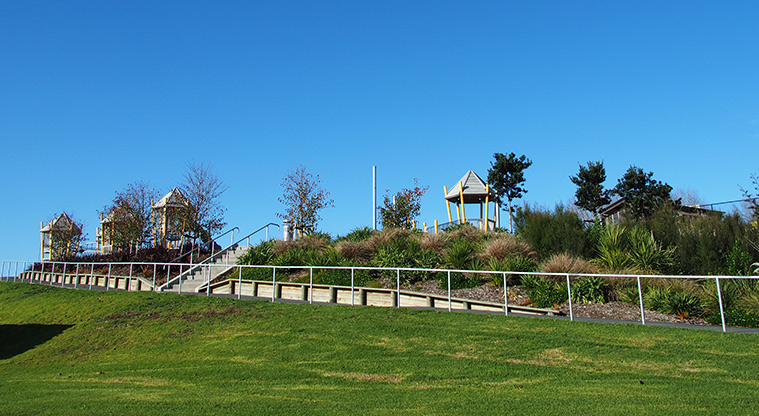 Royal Reserve - Looking up a slope from the sports fields to a path and steps up to the playground. Photo credit: Tracey Hodder.
