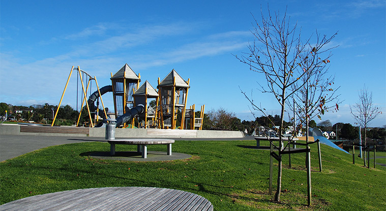 Royal Reserve - Round slat seating with the playground in the background. Photo credit: Tracey Hodder.