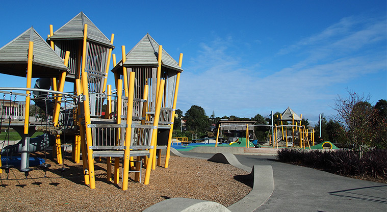 Royal Reserve - Large playground for older children with a path running along one side, and a play area for younger children in the background. Photo credit: Tracey Hodder.