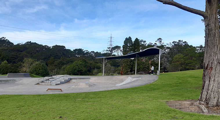 Tiakina / Sister Rene Shadbolt Park - Skate park and shelter with trees in the background.
