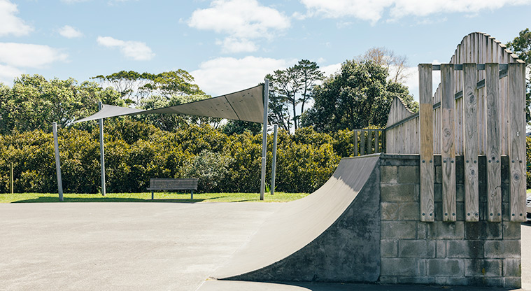 Stanmore Bay Park - Section of the skate park showing the half-pipe with a seat and shade sail in the background. Photo credit: J Farnworth.