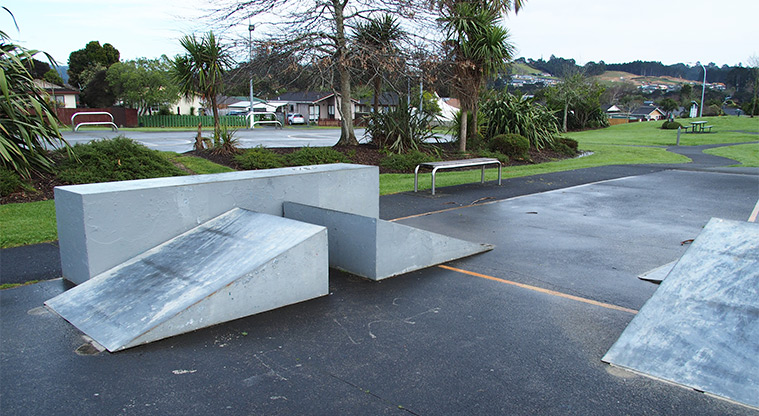 Starling Park - Section of the skate ramps with a bench seat, picnic table and open space in the background. Photo credit: Tracey Hodder.