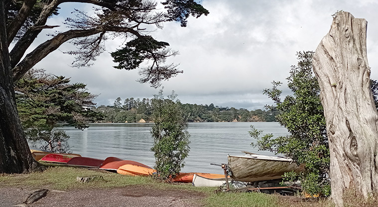 Surfdale Beach - Dinghies and a small boat on a trailer with the bay in the background.. Photo credit: K Sumner.