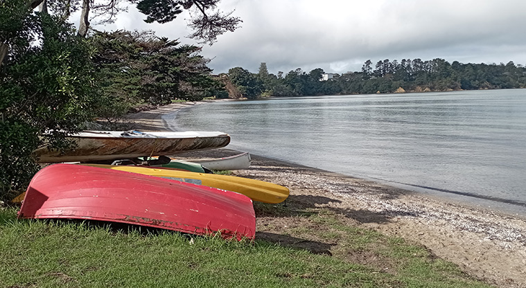 Surfdale Beach - Dinghies lined up along the roadside with the beach and bay in the background. Photo credit: K Sumner.